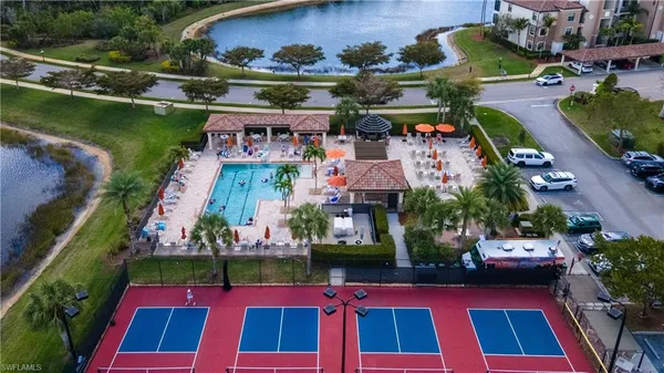 an aerial view of multiple houses with yard