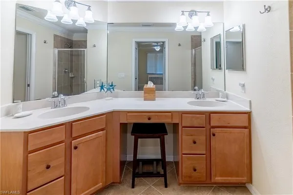 a bathroom with a sink double vanity and a mirror