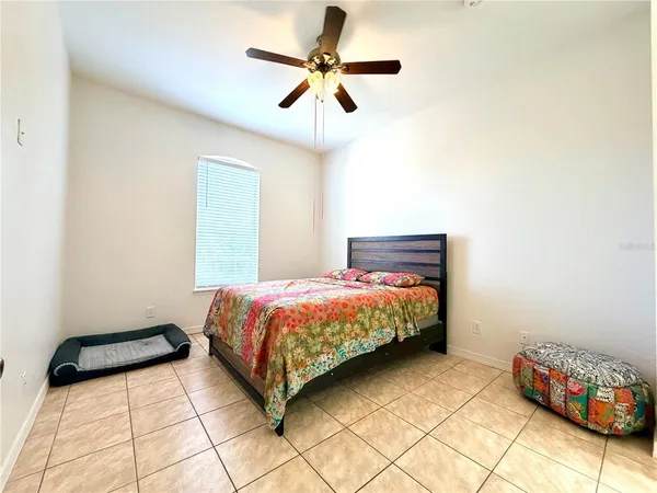 a spacious bathroom with a sink and a mirror