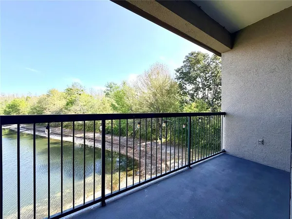 a view of a lake with couches