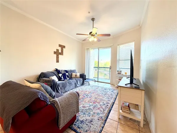 a kitchen with stainless steel appliances kitchen island granite countertop a refrigerator and a sink