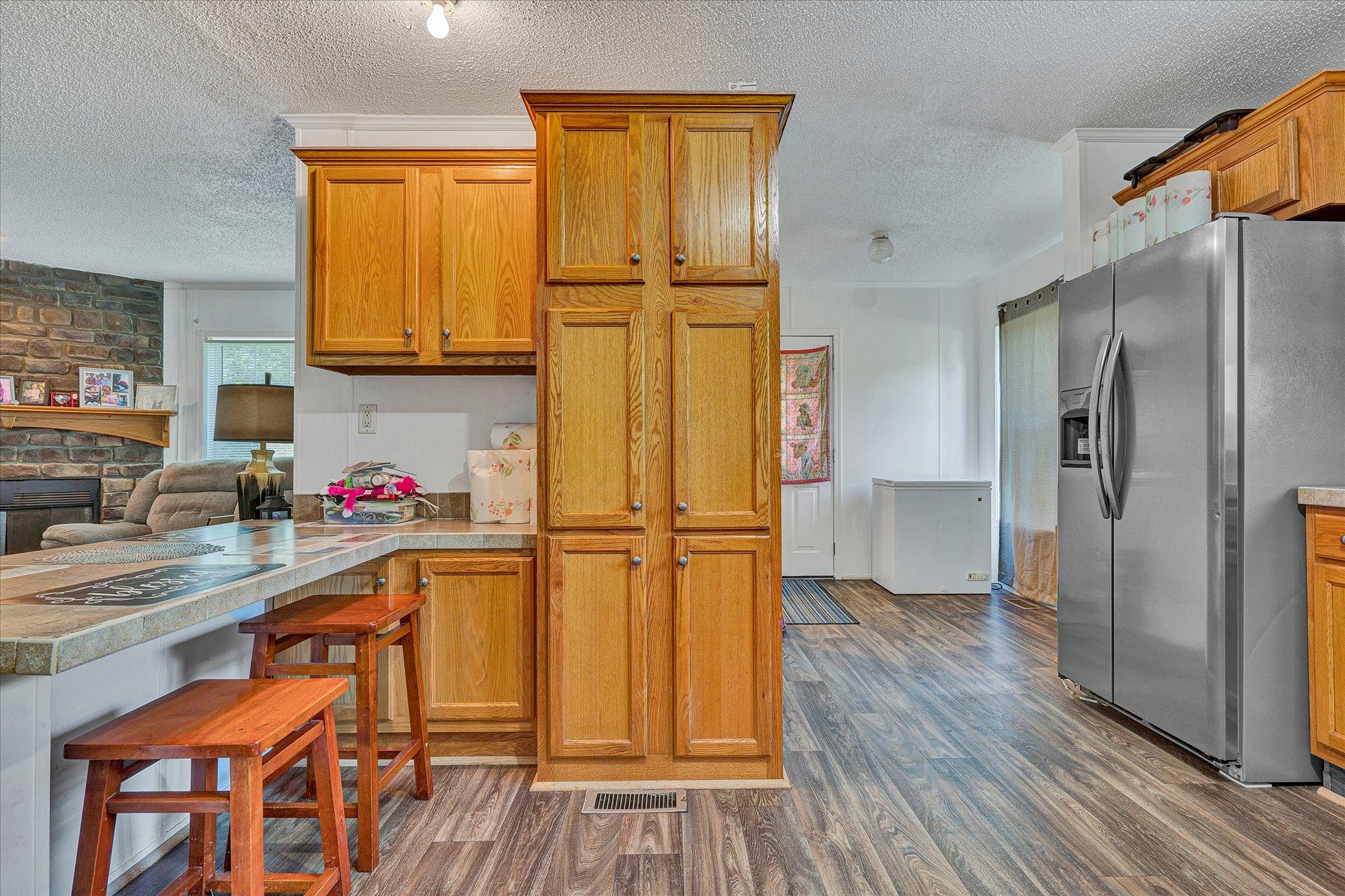108 Summitt Ridge Drive Blue Ridge, VA 24064 - Photo 13 of 30 a kitchen with a refrigerator and wooden floor