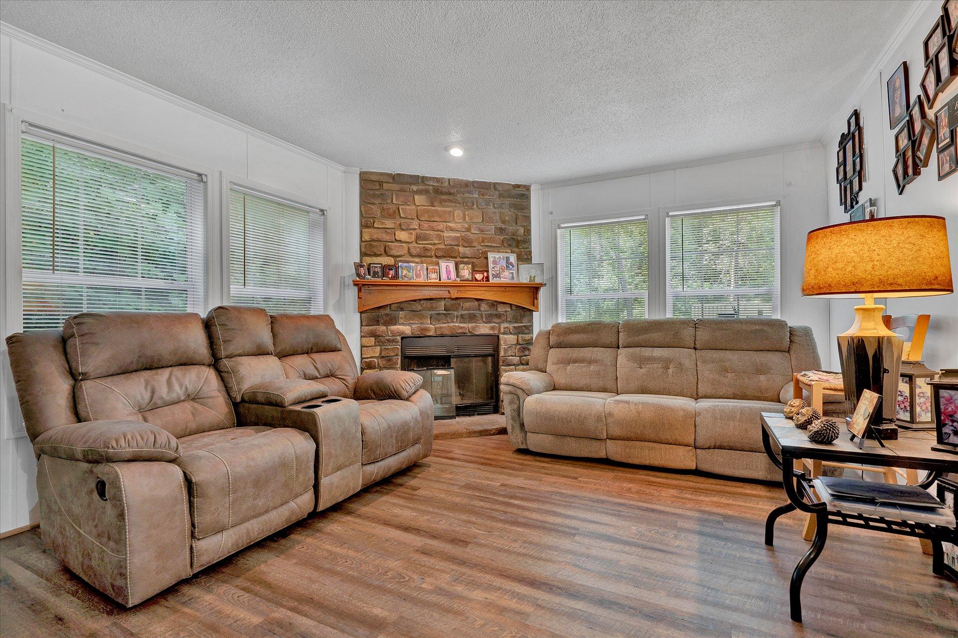 108 Summitt Ridge Drive Blue Ridge, VA 24064 - Photo 16 of 30 a living room with furniture and a flat screen tv