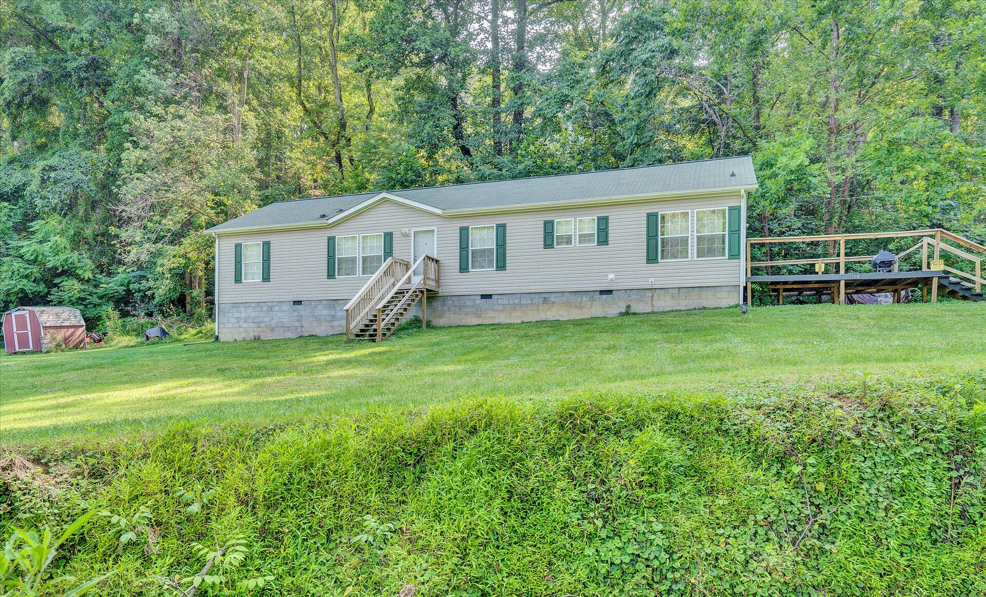 108 Summitt Ridge Drive Blue Ridge, VA 24064 - Photo 3 of 30 a view of a house with a yard and sitting area
