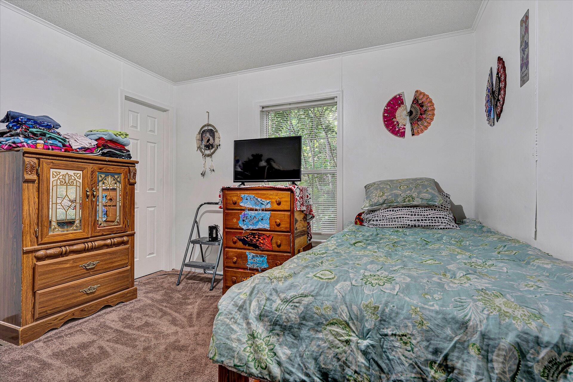 108 Summitt Ridge Drive Blue Ridge, VA 24064 - Photo 21 of 30 a bedroom with a bed and wooden floor