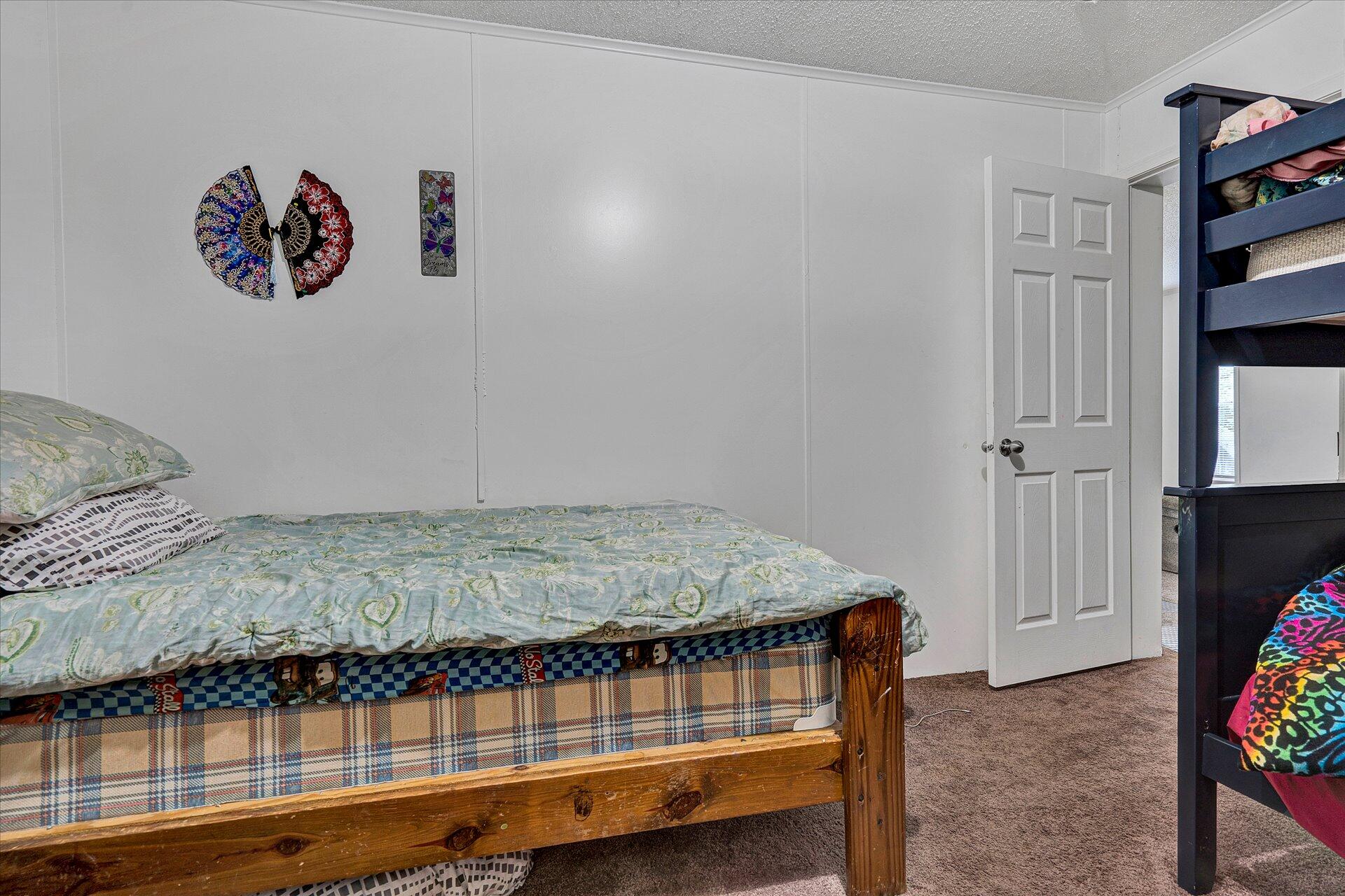 108 Summitt Ridge Drive Blue Ridge, VA 24064 - Photo 22 of 30 a bedroom with a bed and a wall painting