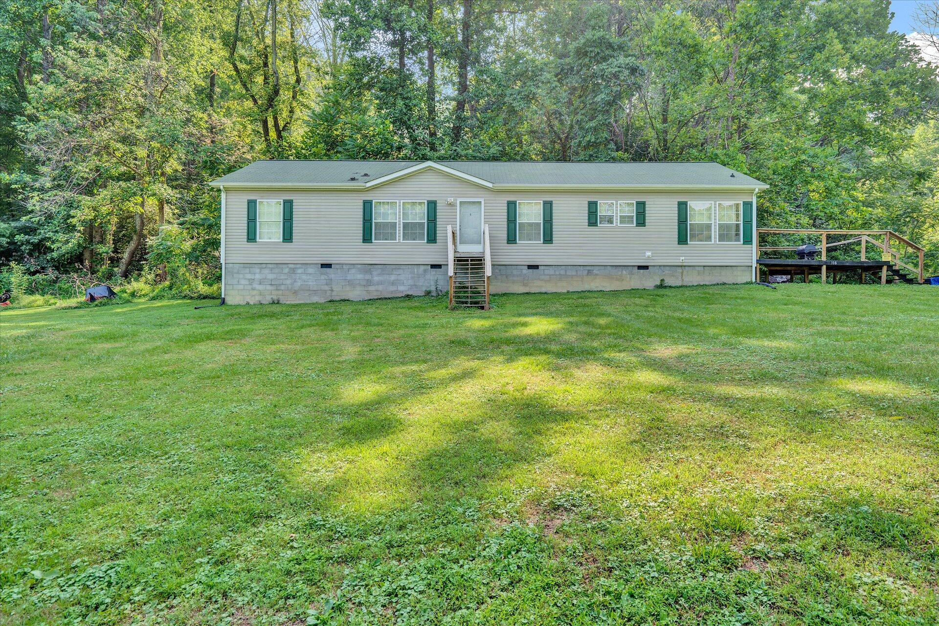 108 Summitt Ridge Drive Blue Ridge, VA 24064 - Photo 30 of 30 a view of house with backyard and outdoor seating