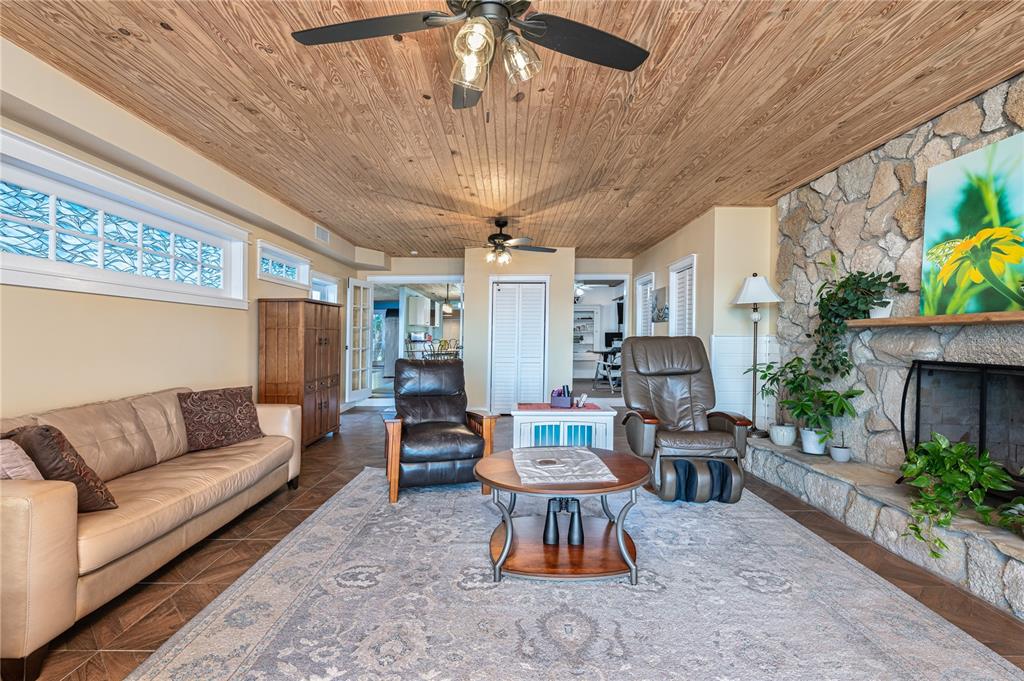 2518 Fort Lane Road Geneva, FL 32732 - Photo 18 of 44 a living room with furniture and a fireplace