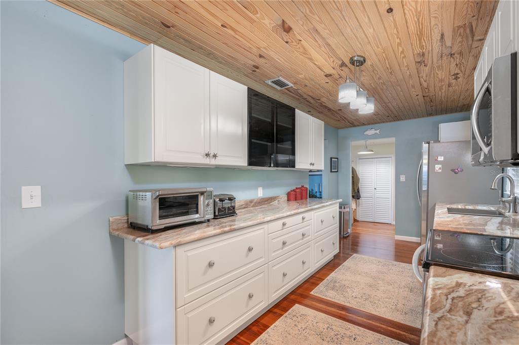 2518 Fort Lane Road Geneva, FL 32732 - Photo 23 of 44 a kitchen with granite countertop a sink stainless steel appliances and cabinets