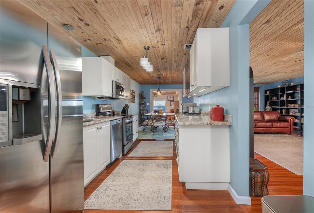 2518 Fort Lane Road Geneva, FL 32732 - Photo 24 of 44 a kitchen with refrigerator and cabinets