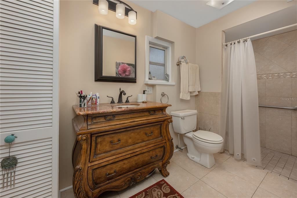 2518 Fort Lane Road Geneva, FL 32732 - Photo 27 of 44 a bathroom with a toilet sink vanity and mirror