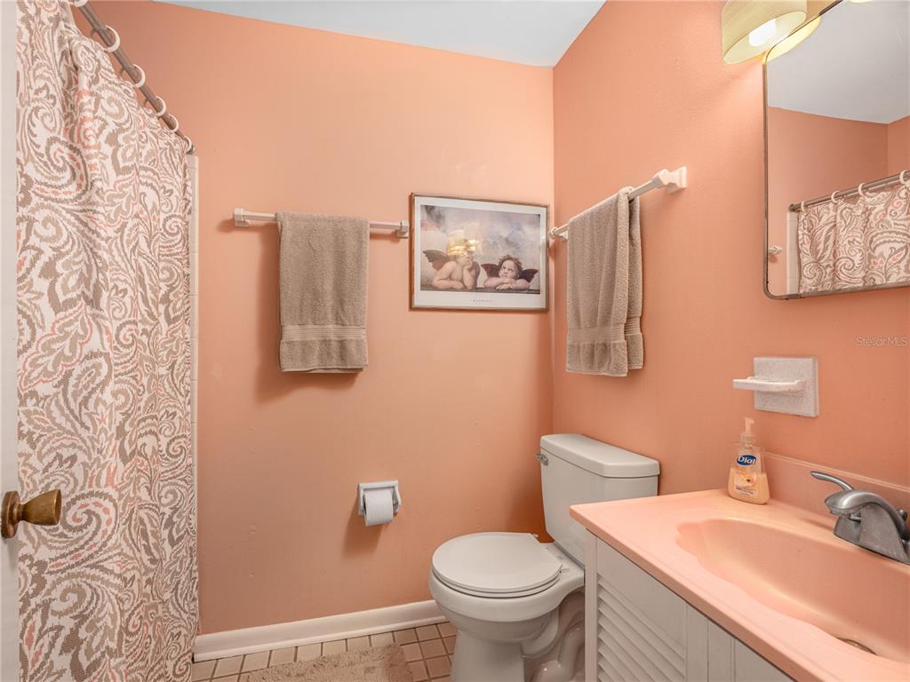 2518 Fort Lane Road Geneva, FL 32732 - Photo 28 of 44 a bathroom with a toilet sink and mirror