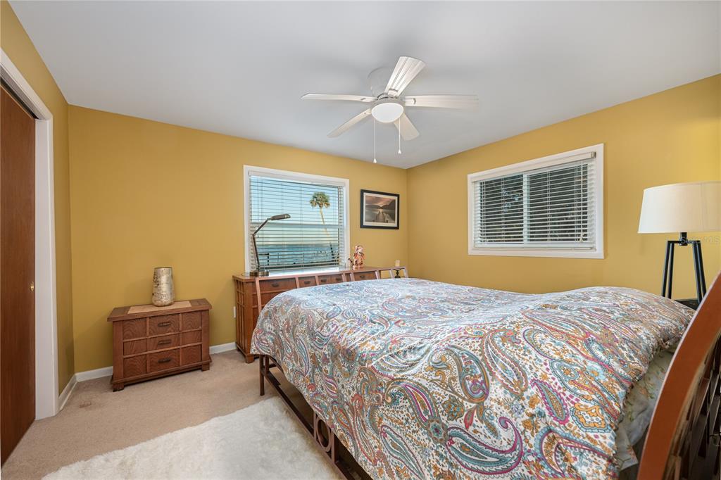 2518 Fort Lane Road Geneva, FL 32732 - Photo 29 of 44 a bedroom with a bed and dresser with mirror