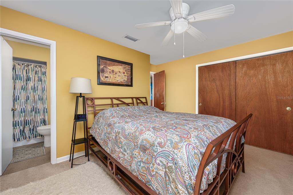 2518 Fort Lane Road Geneva, FL 32732 - Photo 30 of 44 a bedroom with a bed and a table