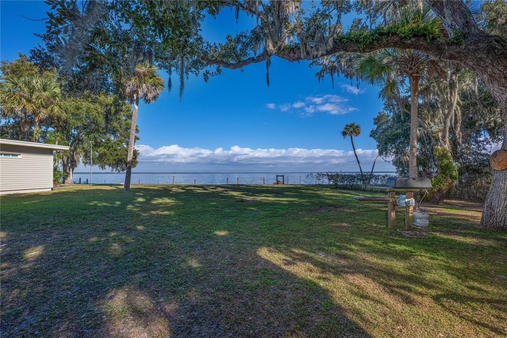 2518 Fort Lane Road Geneva, FL 32732 - Photo 5 of 44 a view of a golf course with a lake