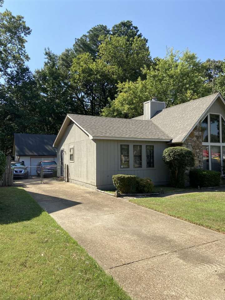 3483 Coleman Road Memphis, TN 38128 - Photo 4 of 4 a front view of a house with a yard and garage