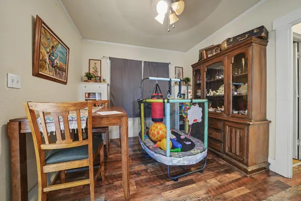 a backyard of a house with barbeque oven and table