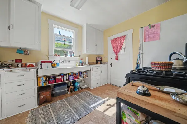 a view of a house with door and wooden floor