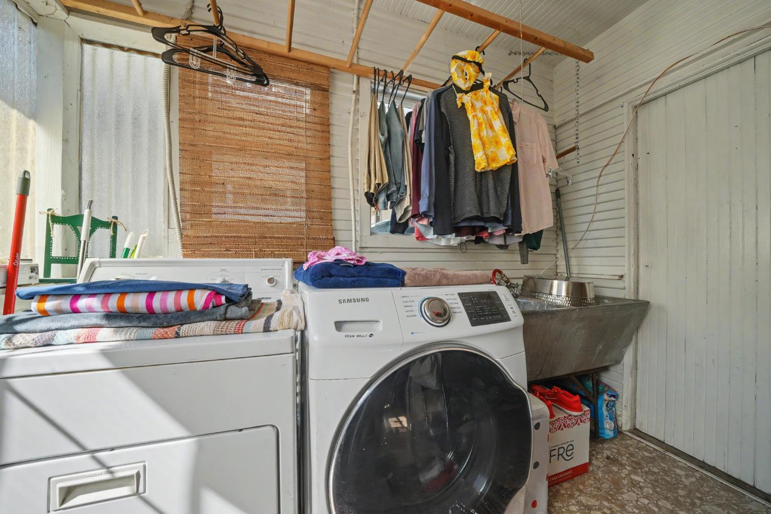 411 Rex Avenue Jackson, CA 95642 - Photo 25 of 72 a utility room with dryer and washer