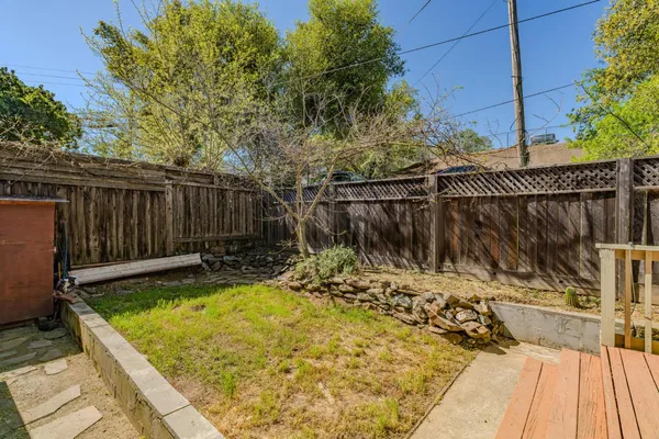 a kitchen with granite countertop a sink stove and cabinets