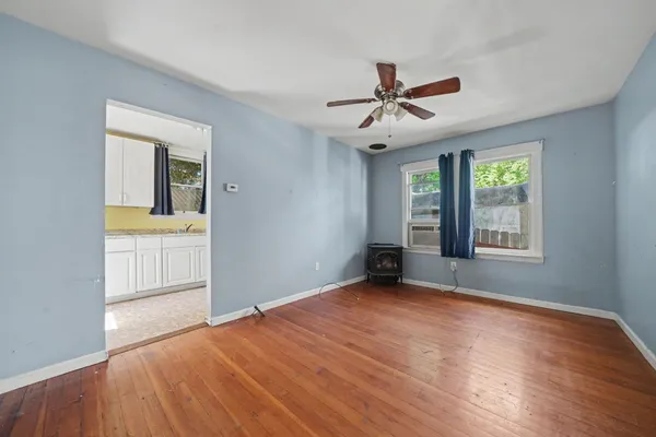 a kitchen that has a stove and a table in it