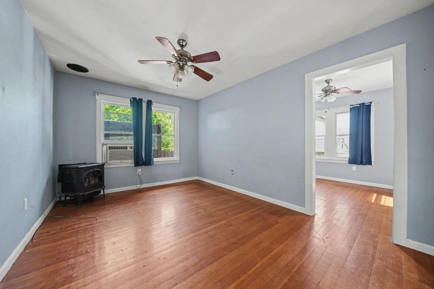 411 Rex Avenue Jackson, CA 95642 - Photo 34 of 72 wooden floor in an empty room with a window