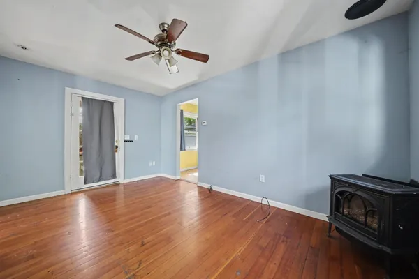 a view of a house with backyard porch and sitting area