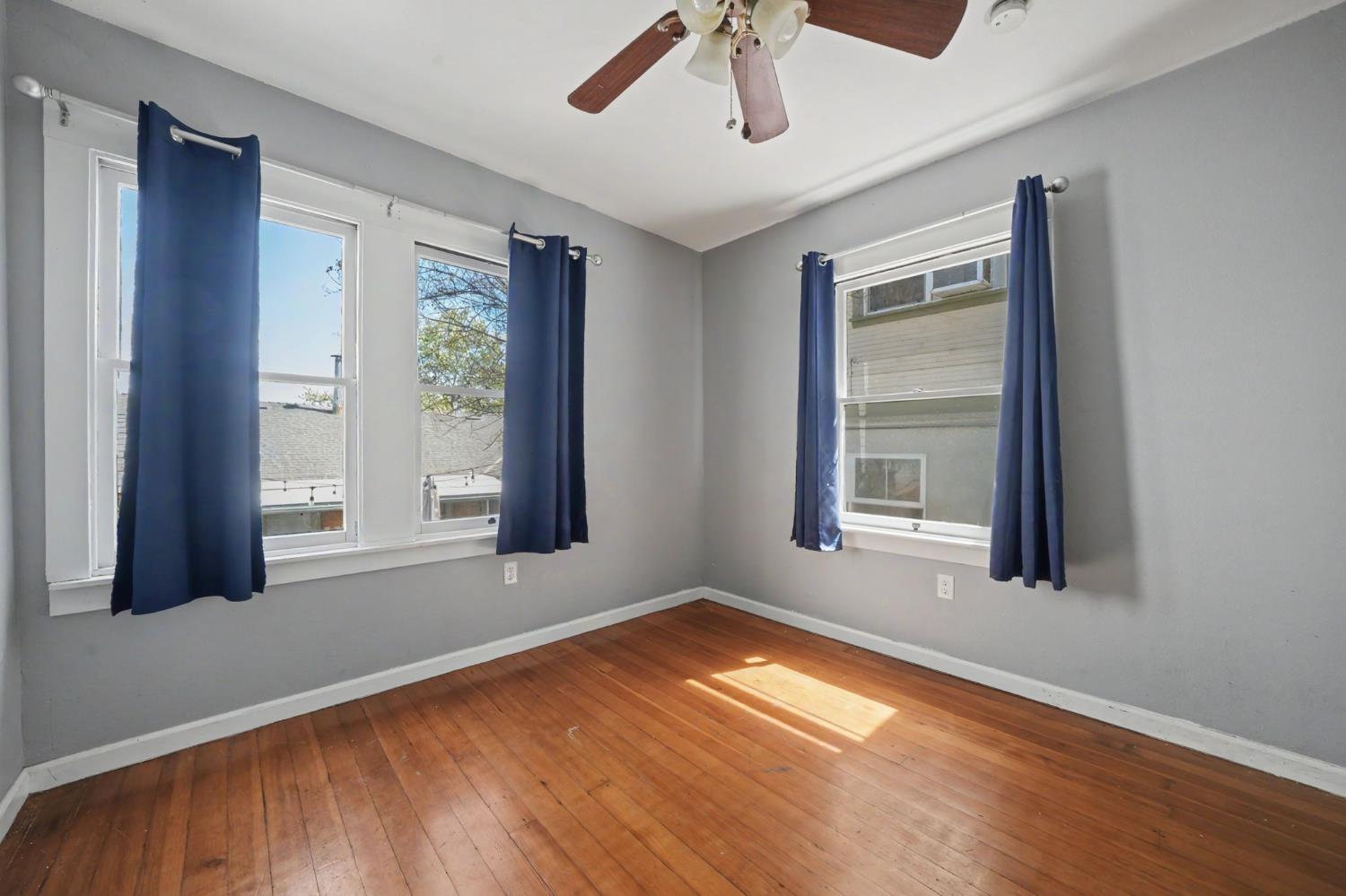 411 Rex Avenue Jackson, CA 95642 - Photo 40 of 72 a view of empty room with wooden floor and fan