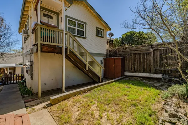 an aerial view of houses with outdoor space