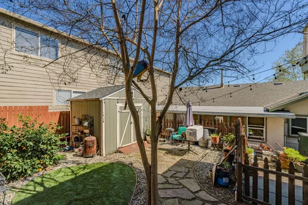 an aerial view of residential houses with outdoor space