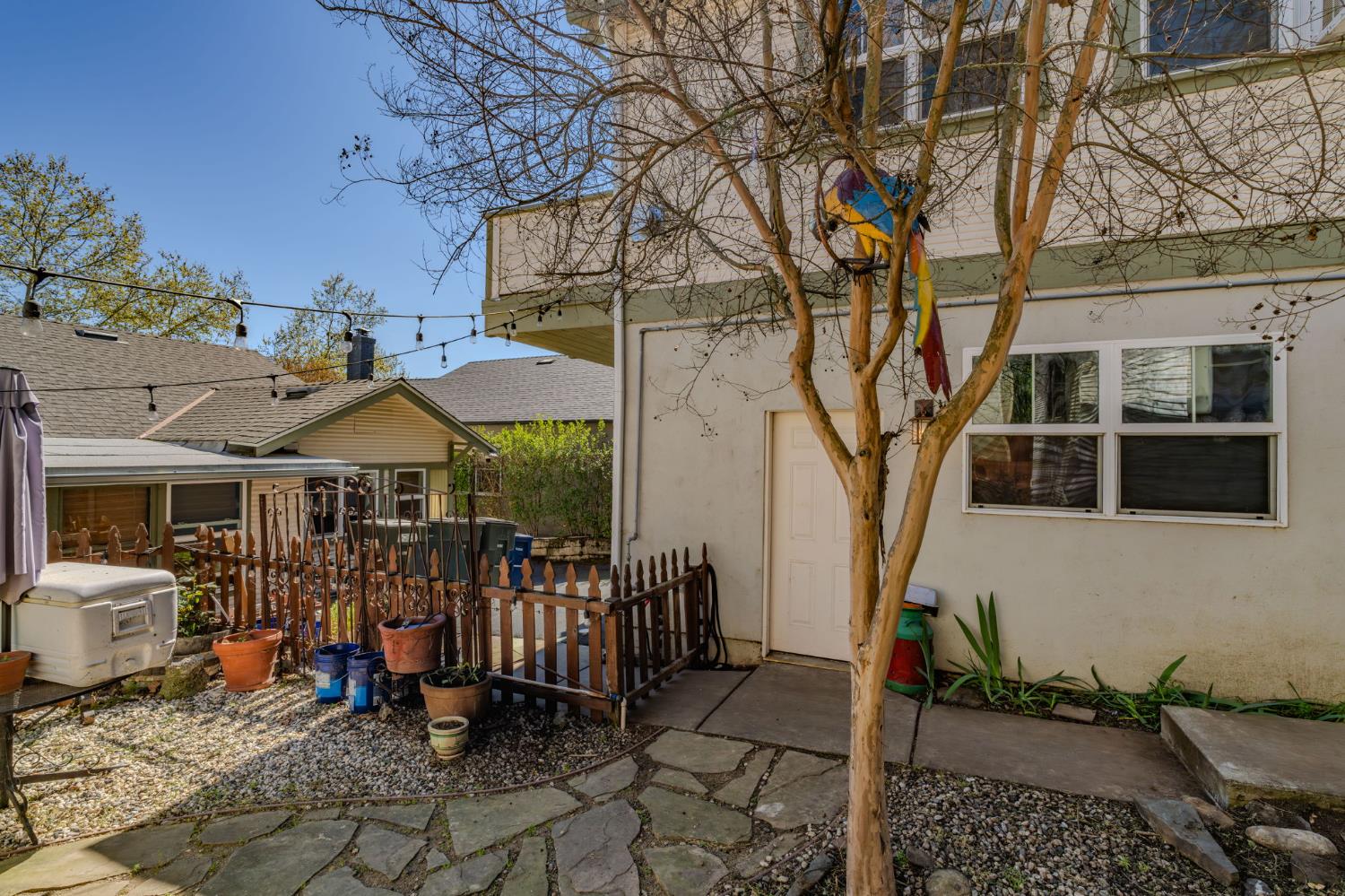 411 Rex Avenue Jackson, CA 95642 - Photo 52 of 72 a view of a patio with table and chairs under an umbrella