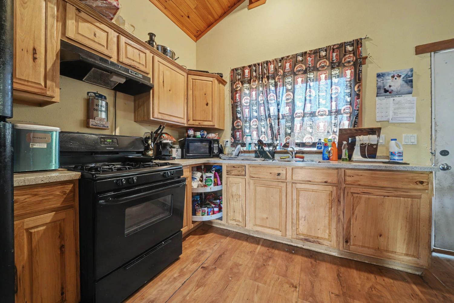 411 Rex Avenue Jackson, CA 95642 - Photo 60 of 72 a kitchen with stainless steel appliances a stove sink and cabinets