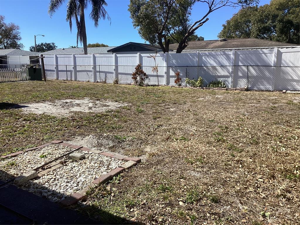 10029 Brandywine Lane Port Richey, FL 34668 - Photo 10 of 11 a view of a house with a yard
