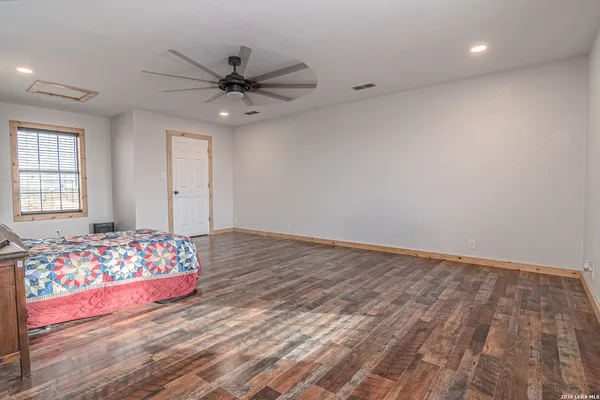 a bedroom with bed and window