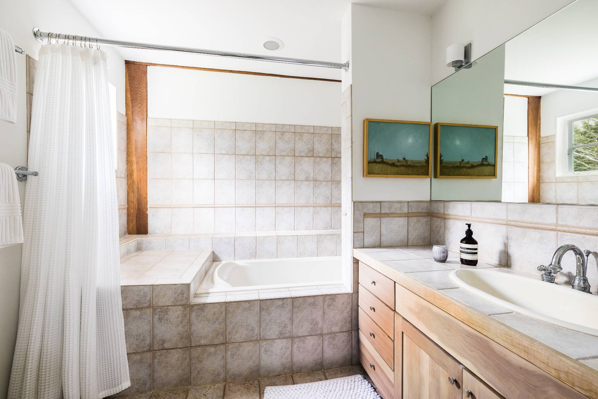 22 Casey Lane Bridgehampton, NY 11932 - Photo 11 of 24 a bathroom with a bathtub and a sink