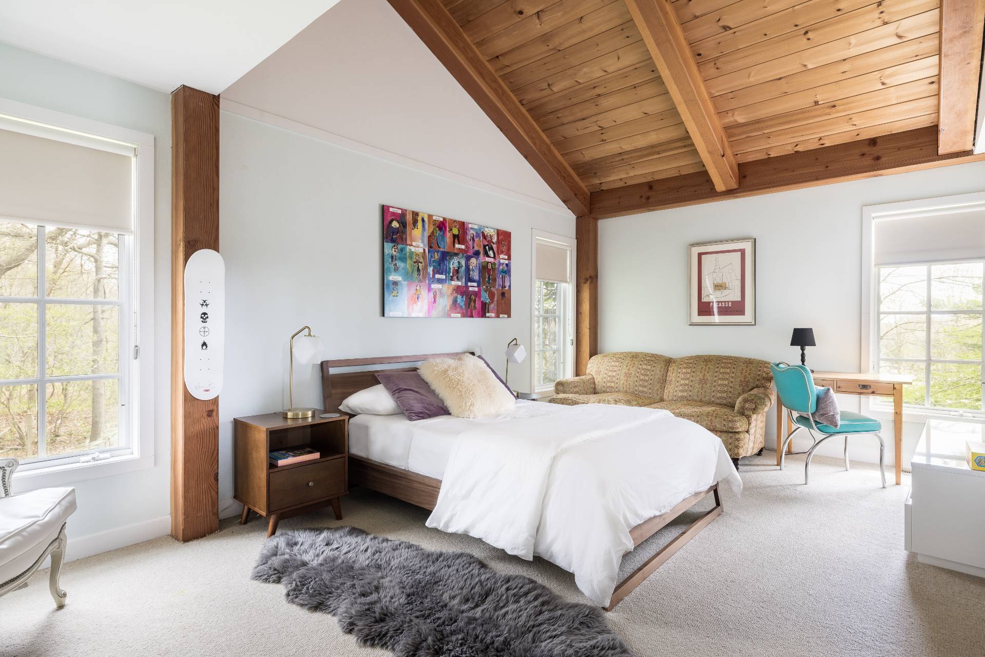 22 Casey Lane Bridgehampton, NY 11932 - Photo 12 of 24 a spacious bedroom with a bed a couch and a window