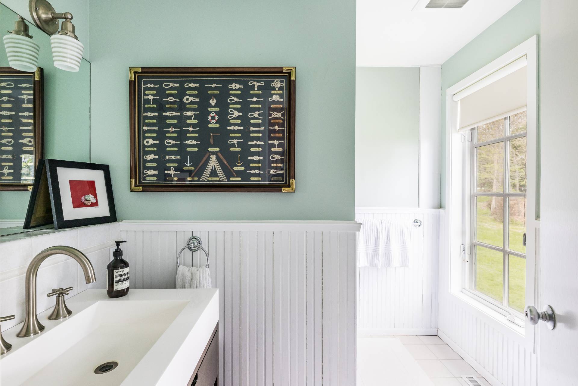 22 Casey Lane Bridgehampton, NY 11932 - Photo 13 of 24 a bathroom with a sink and a large mirror