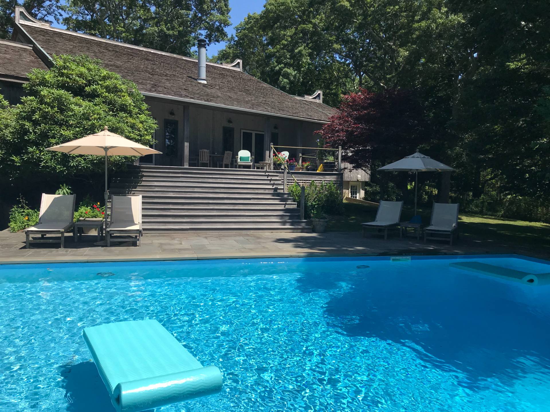 22 Casey Lane Bridgehampton, NY 11932 - Photo 18 of 24 a front view of a house with garden