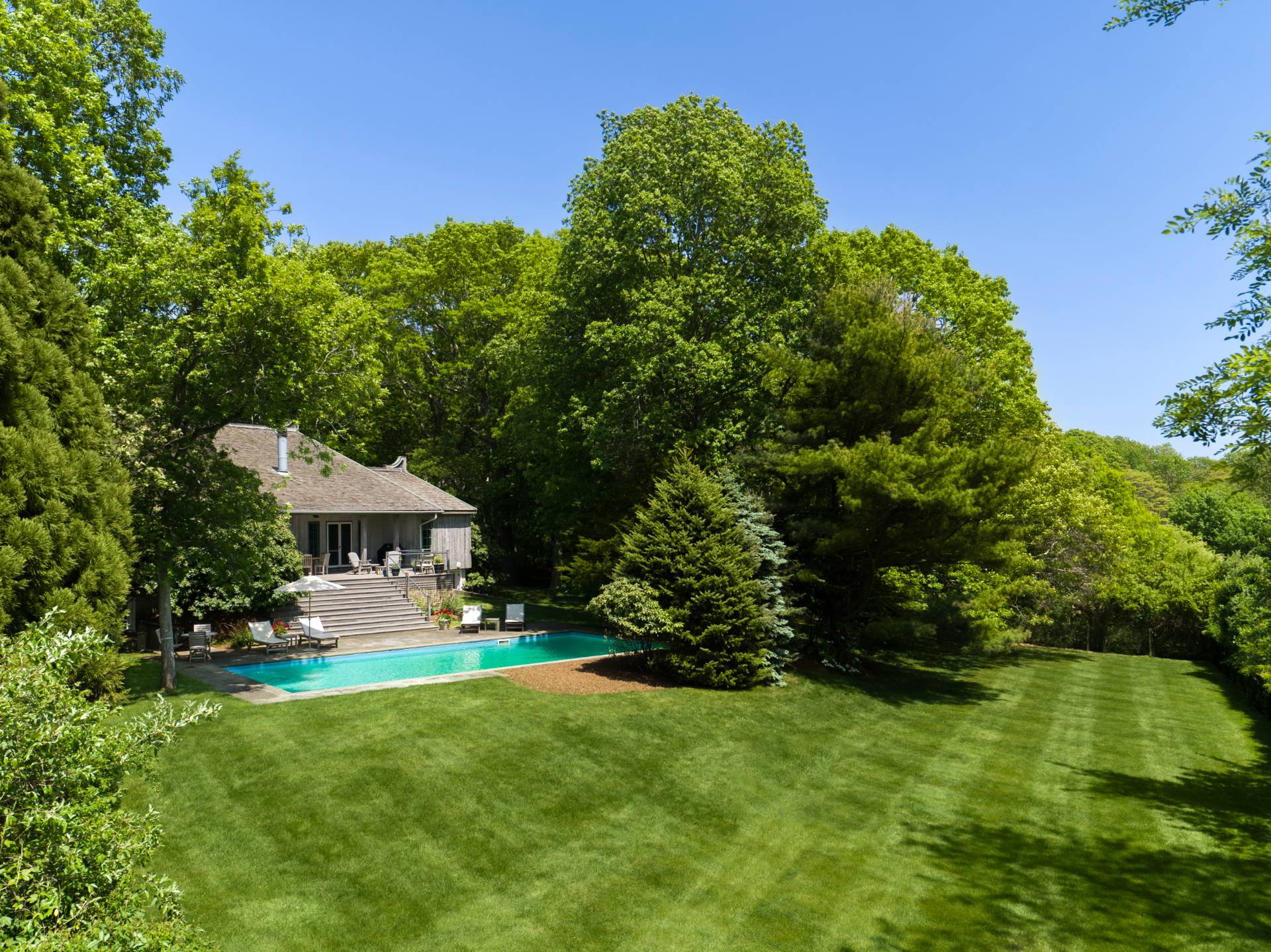 22 Casey Lane Bridgehampton, NY 11932 - Photo 19 of 24 a view of a house with a yard