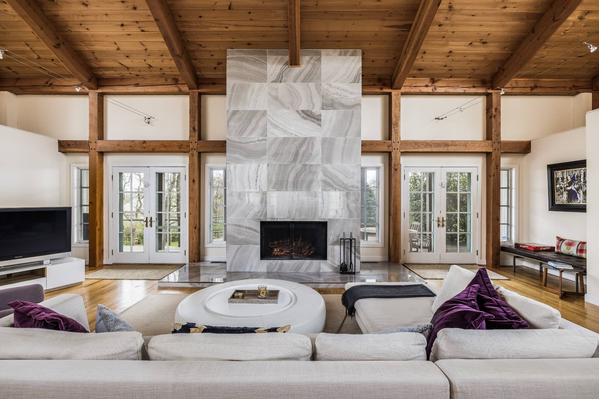 22 Casey Lane Bridgehampton, NY 11932 - Photo 2 of 24 a living room with furniture and a fireplace
