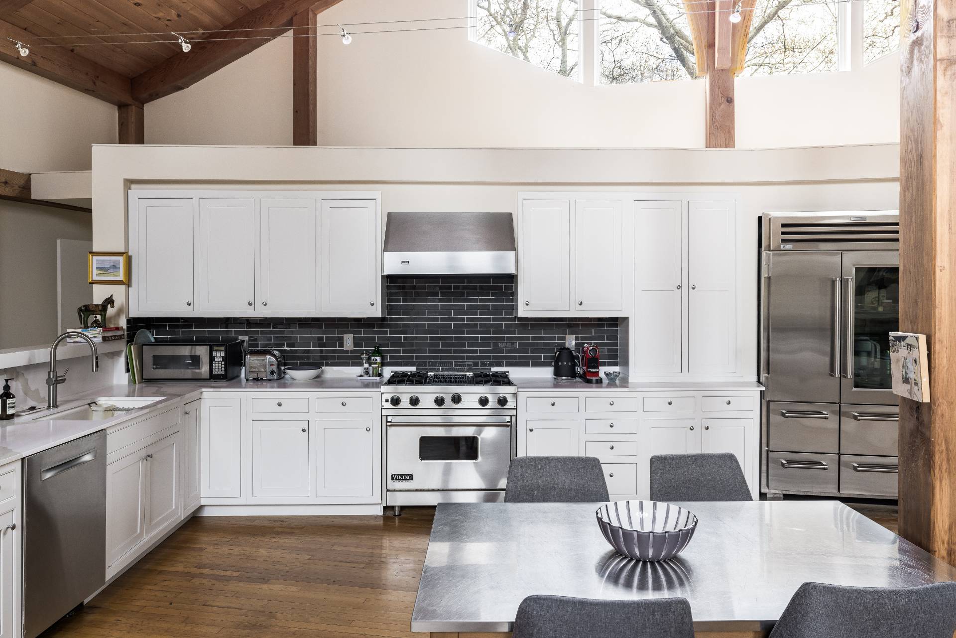 22 Casey Lane Bridgehampton, NY 11932 - Photo 5 of 24 a kitchen with a stove a sink and a refrigerator