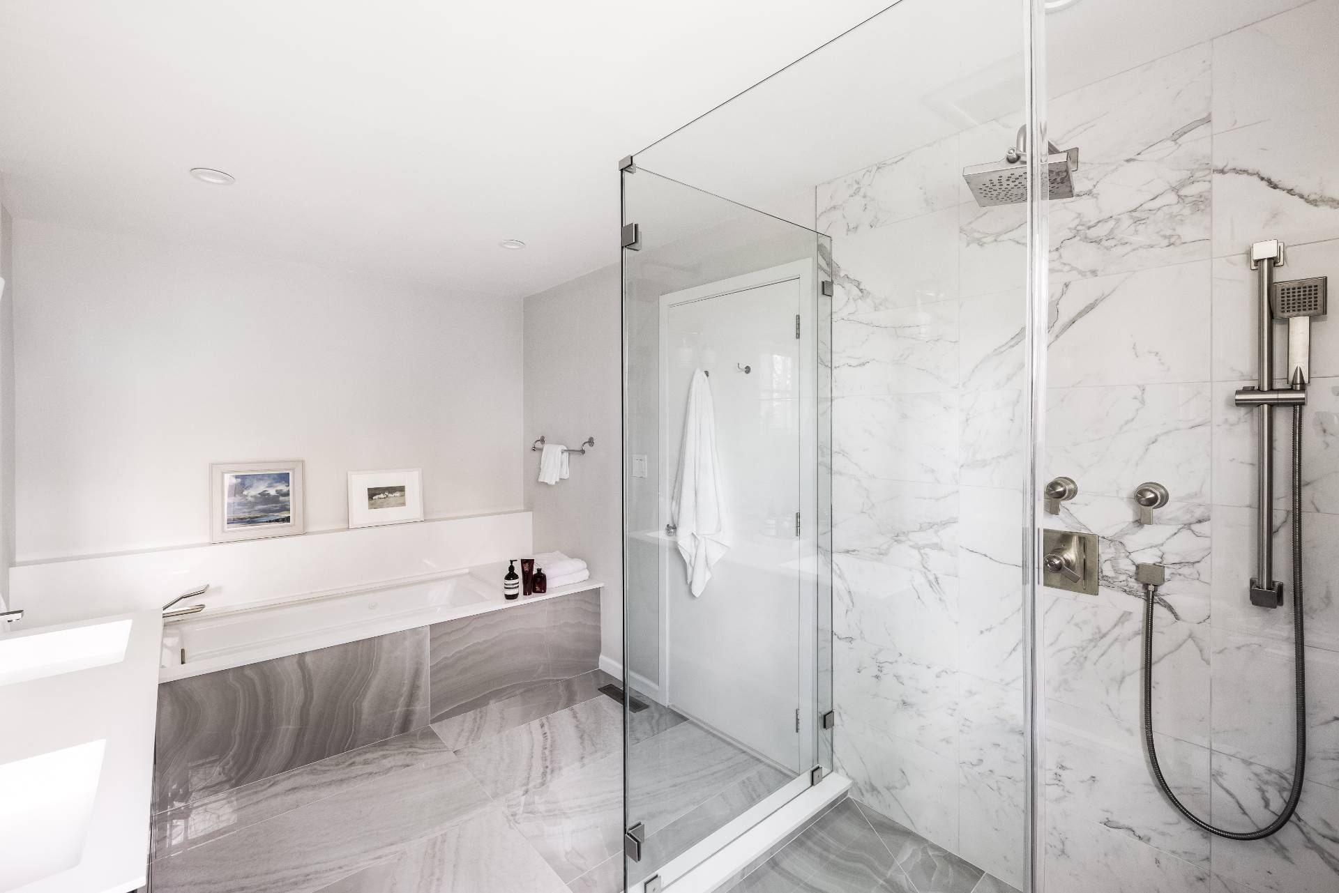 22 Casey Lane Bridgehampton, NY 11932 - Photo 7 of 24 a bathroom with a granite countertop shower a mirror and a sink