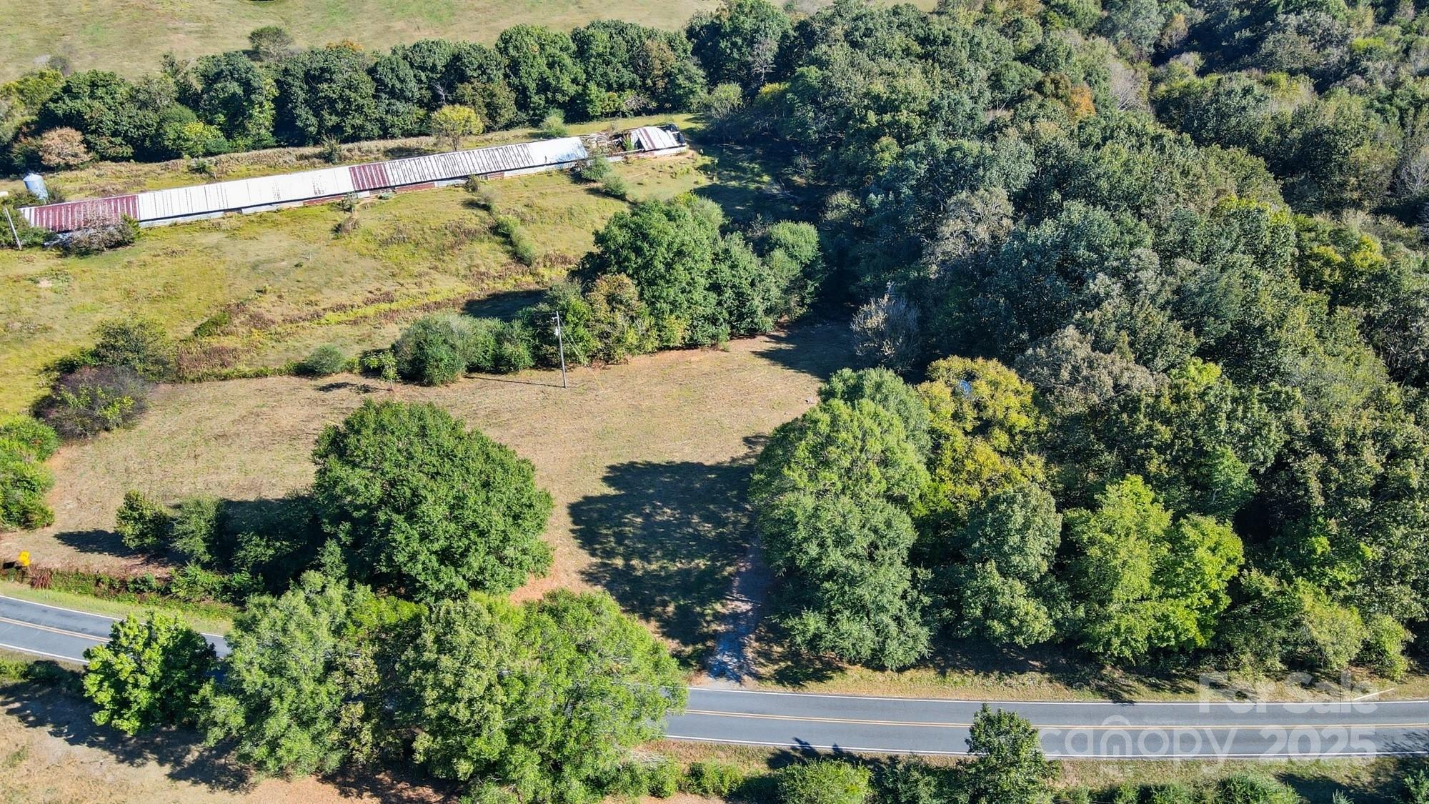 a view of a garden with a building in the background