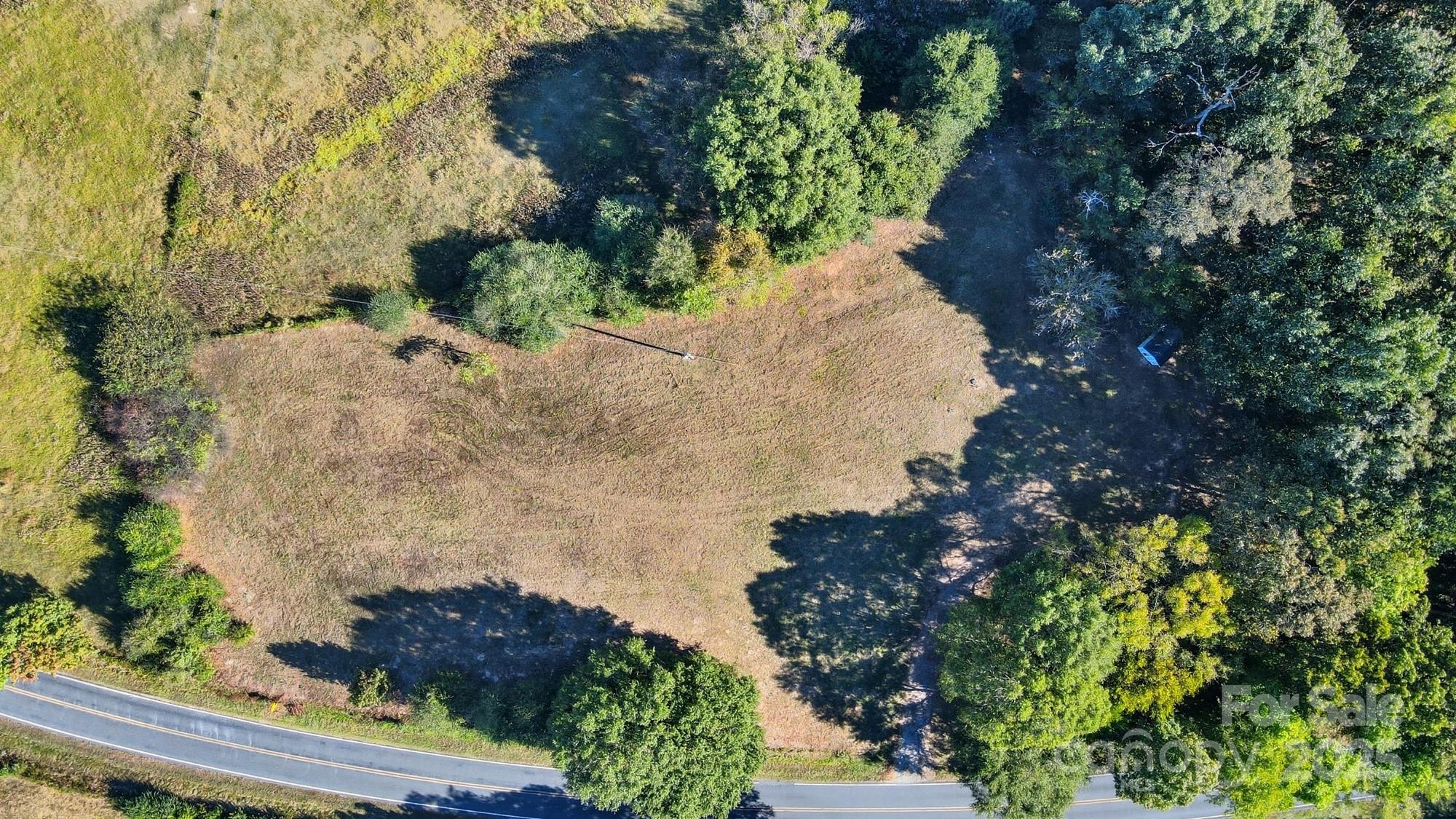 2686 Love Mill Road Stanfield, NC 28163 - Photo 3 of 3 a view of a garden with a pathway