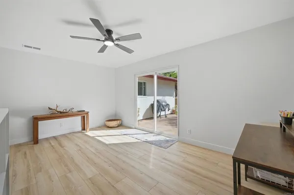 a bedroom with a bed and a desk