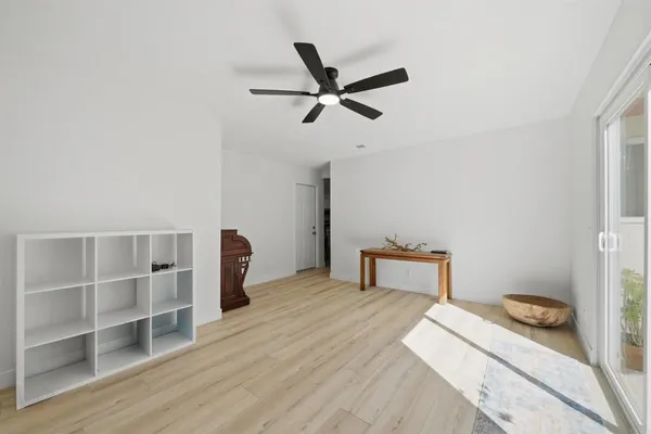 a bedroom with bed and window