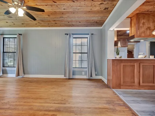 a view of a house with yard and a garden