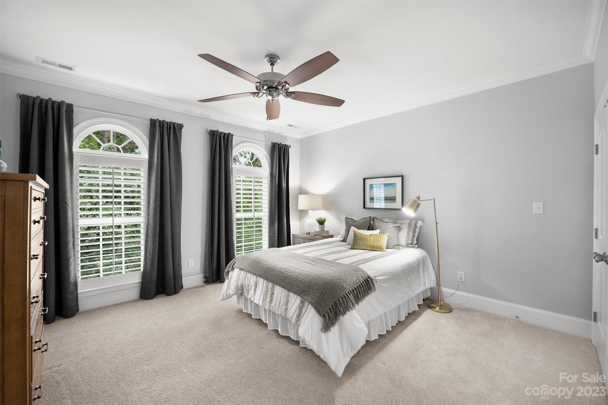 3118 Sharon View Road Charlotte, NC 28210 - Photo 11 of 48 a bedroom with a bed and a chandelier