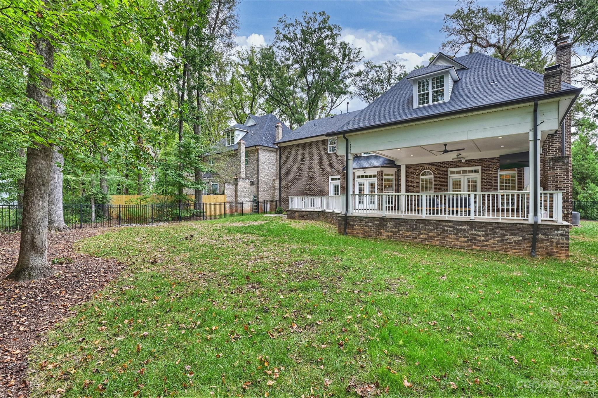 3118 Sharon View Road Charlotte, NC 28210 - Photo 12 of 48 a view of a house with yard and a garden