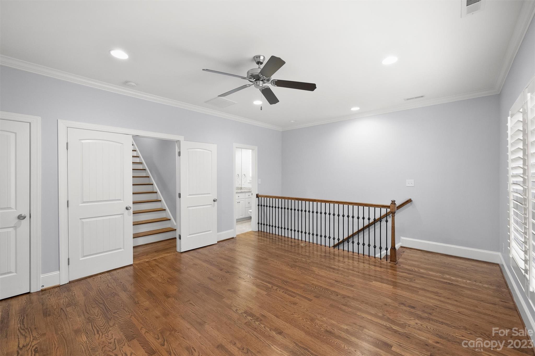 3118 Sharon View Road Charlotte, NC 28210 - Photo 16 of 48 a view of a hallway with stairs and wooden floor